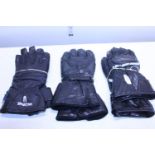Three pairs of assorted motorbike gloves (used)