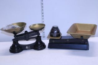 Two sets of kitchen scales with weights