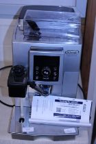 A DeLonghi bean to cup espresso and cappuccino machine with instructions etc (untested), shipping