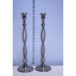 Two tall contempery candlesticks