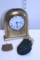 A vintage brass mantle clock and two vintage coin purses