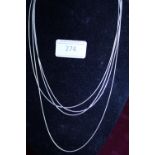 Four silver necklaces