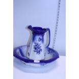 A blue and white ceramic jug and basin set, shipping unavailable