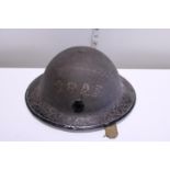 A British WWII civil defence helmet marked CBAF (possibly Castle Bromwich Aircraft factory)