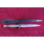 A Fairbairn Sykes commando fighting knife pattern 3 (faint 1 to pommel) WW2 issue with scabbard