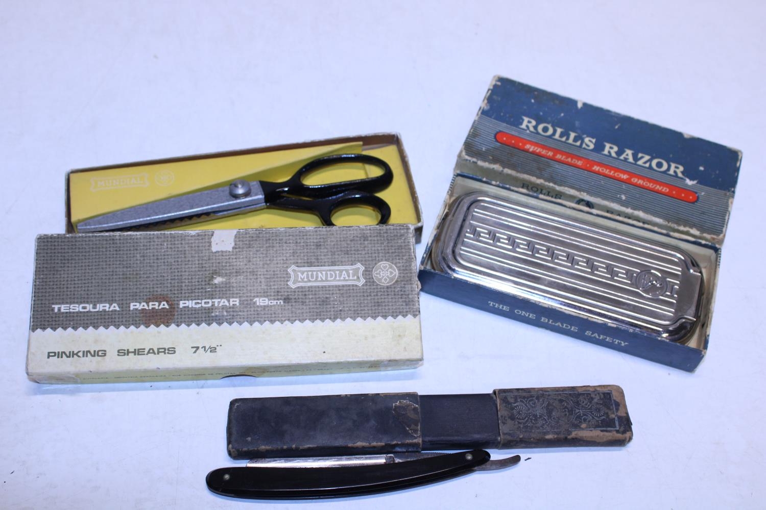 Two vintage razors including a Rolls razor and pinking shears
