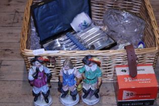 A wicker basket and contents of collectables