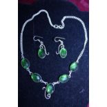 A 925 silver necklace and earring set with green stones