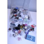 A large quantity of new keyrings and badges etc