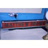 A vintage Matthew Brown wooden hanging pub sign. Shipping unavailable