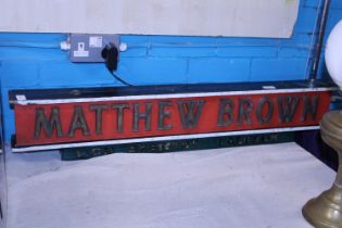 A vintage Matthew Brown wooden hanging pub sign. Shipping unavailable