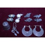 A selection of white metal and silver earrings etc