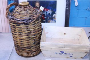 A vintage wicker work basket with stoneware flagon and four Jersey Oyster wooden punnets