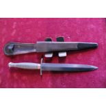 A Fairbairn Sykes pattern 3 commando fighting knife, No 3 to pommel (WW2 issue) and scabbard