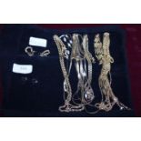 A good selection of gold tone necklaces and other