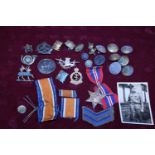 A job lot of military badges and buttons including a WW1 medal awarded to 5835 PTE F N G Keown