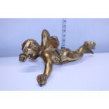 A antique plaster & gilt cherub