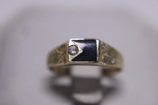 A 14ct gold Black Onyx and Diamond ring 2.14g. Size M1/2.