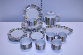 A vintage mid-winter tea service including Teapot. Shipping unavailable