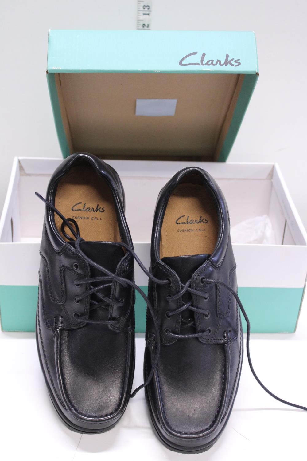 A new pair of Clarks shoes size 9