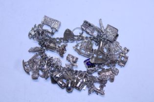 A heavy hallmarked silver charm bracelet 85.51g