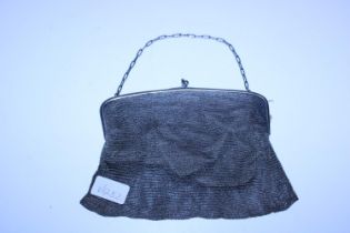 A hallmarked silver ladies evening purse with inscription dated 1942
