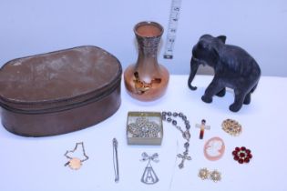 A selection of collectables including brooches etc