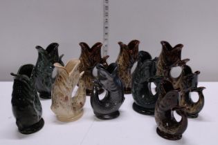 A job lot of assorted Foster's studio art pottery fish vases, shipping unavailable