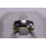 A 9ct gold band ring 3.39g. Size L.