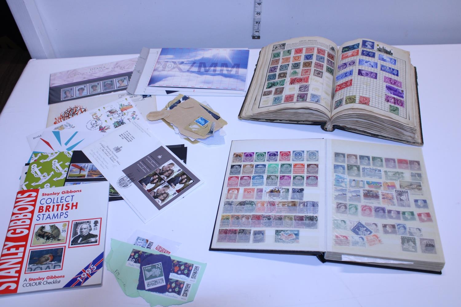 Two vintage stamp albums and a selection of First Day Covers