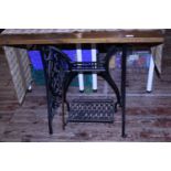 A singer sewing base converted into a coffee table, shipping unavailable