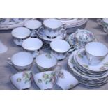 A selection of part tea services including Royal Albert and Minton 'Haddon Hall'. Shipping