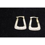 A pair of 9ct gold and white stone earrings 1.33g