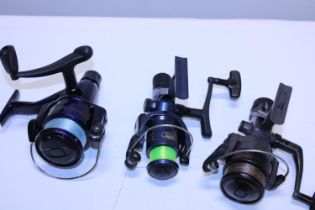 Three assorted fishing reels