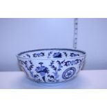 A Oriental ceramic bowl with blue and white glaze