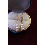 A pair of 18ct gold and seed pearl drop earrings