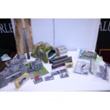 A box full of assorted OO gauge railway accessories and other items. No shipping.