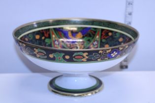 A hand decorated footed bowl