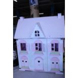 A child's doll house with furniture etc. No shipping.