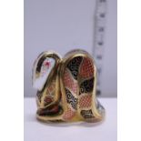 A boxed Royal Crown Derby paperweight with gold stopper 'Old Imari Snake'