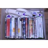 A box full of assorted PC games and other items