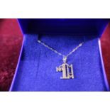 A 9ct gold pendant and chain 0.73g