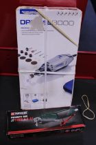 A new boxed pneumatic saw and Dremel 3000 tool