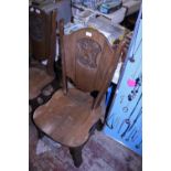 A heavy Oak antique church chair with carved back