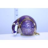 A Royal Crown Derby paperweight badger with gold stopper