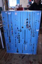 A large selection of costume jewellery necklaces etc (board not included)