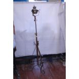 A antique church floor standing oil lamp