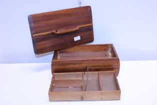 A vintage wooden sewing box with lid
