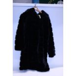 A faux fur ladies coat size 8