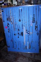 A large selection of costume jewellery necklaces etc (board not included)